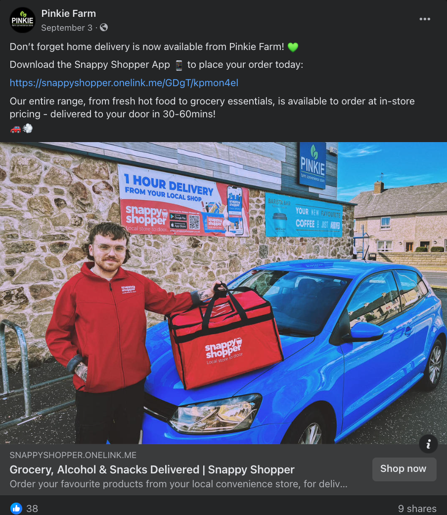 A person holding a red bag next to a blue car

Description automatically generated